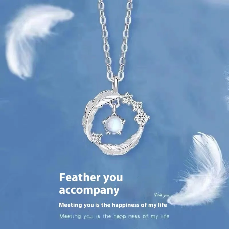Feather‑shaped silver‑plated pendant necklace with round moonstone bead