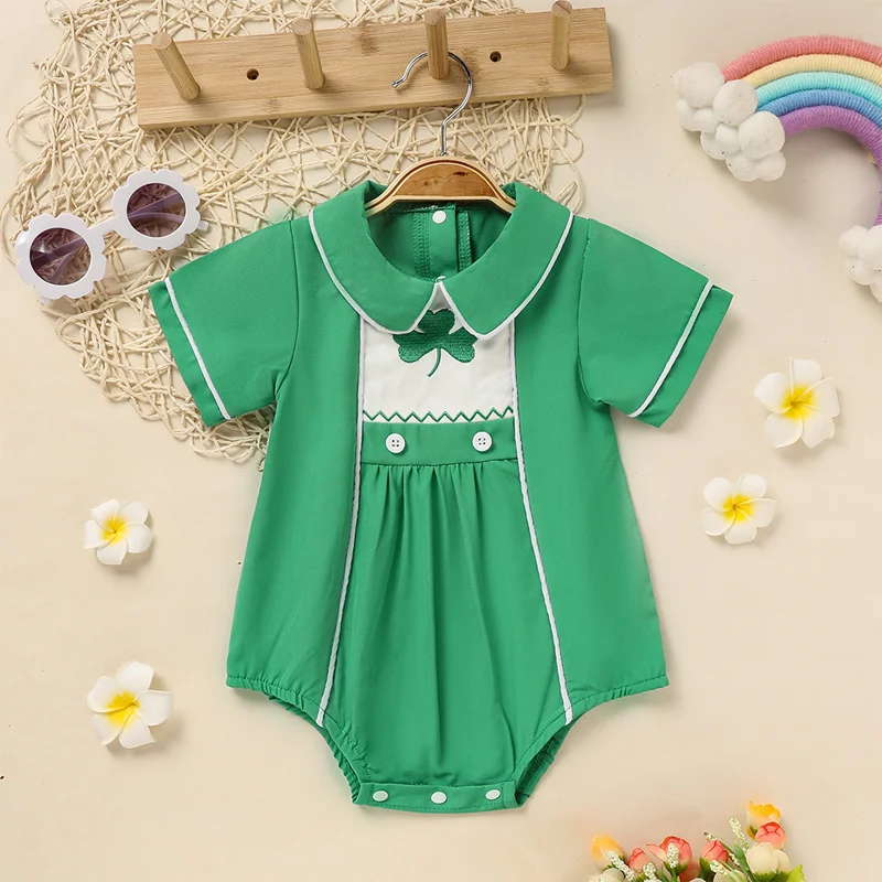 Baby green lapel romper with clover print, button detail and snap closures