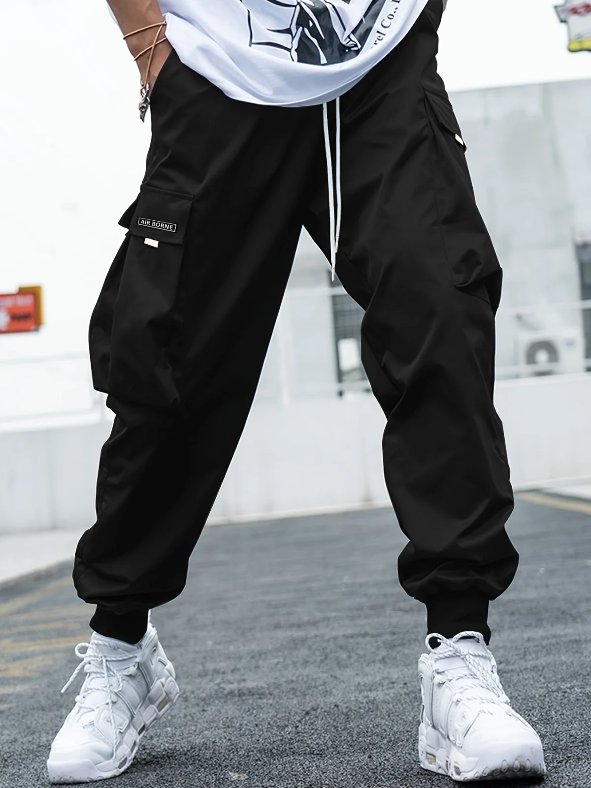 Men's casual cargo pants with multi‑pocket design, drawstring waist and loose fit