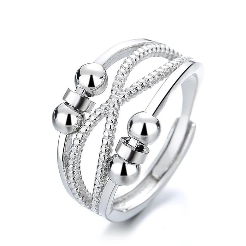 Rotatable platinum‑colored copper ring with double‑layer hollow geometry
