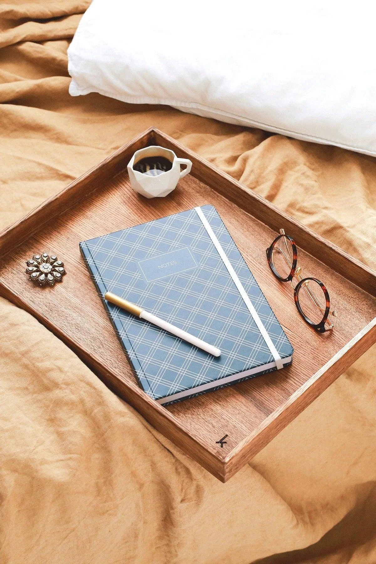 Hardcover lined notepad with elastic closure and pocket