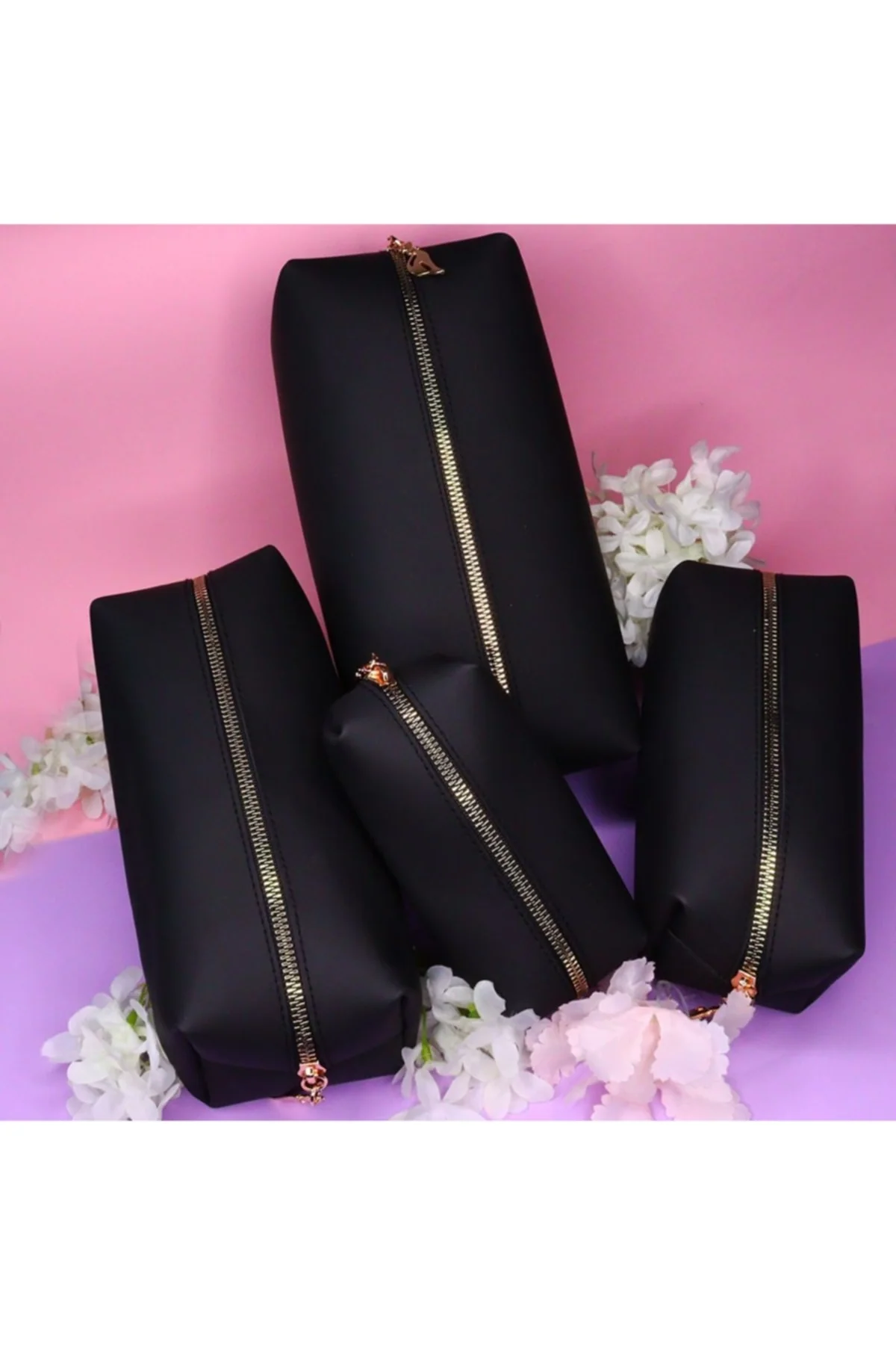 Black set of four small makeup and personal item bags