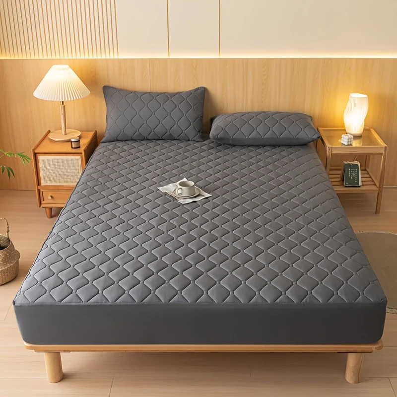 Waterproof mattress protector with embossed fitted sheet design