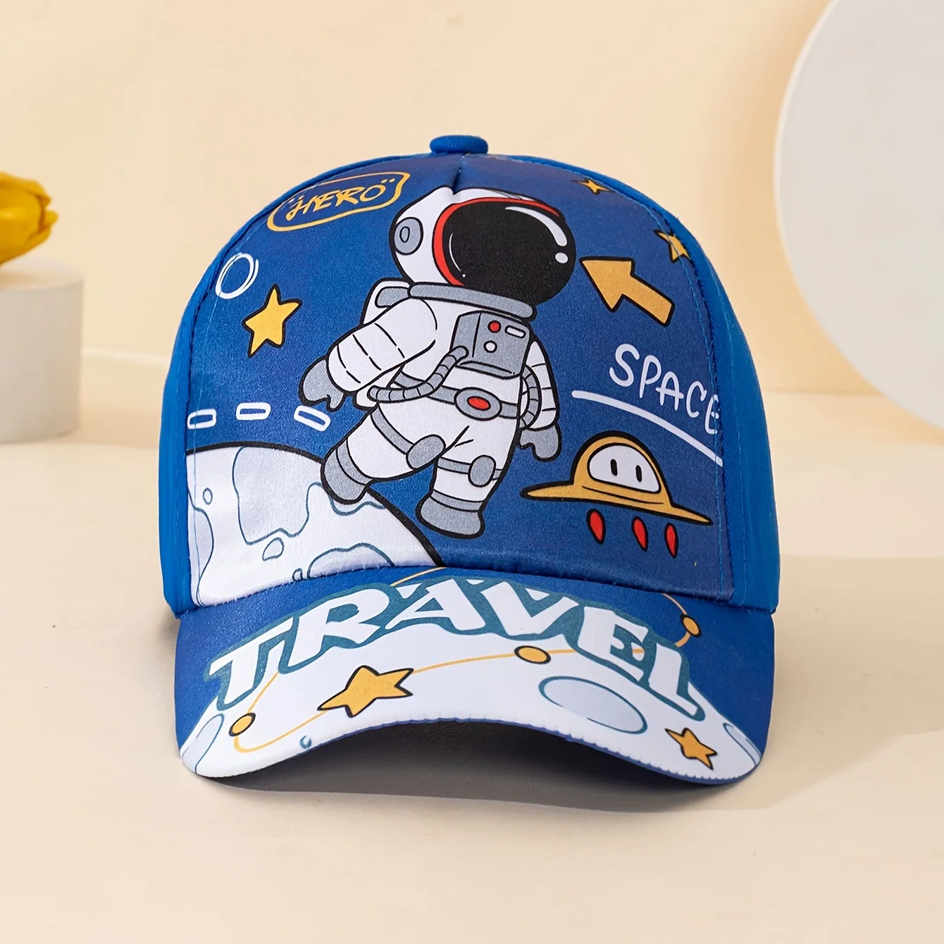 Space-themed adjustable baseball cap with astronaut and UFO print
