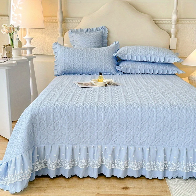 Quilted bedspread set with ruffle detailing for modern bedroom styling