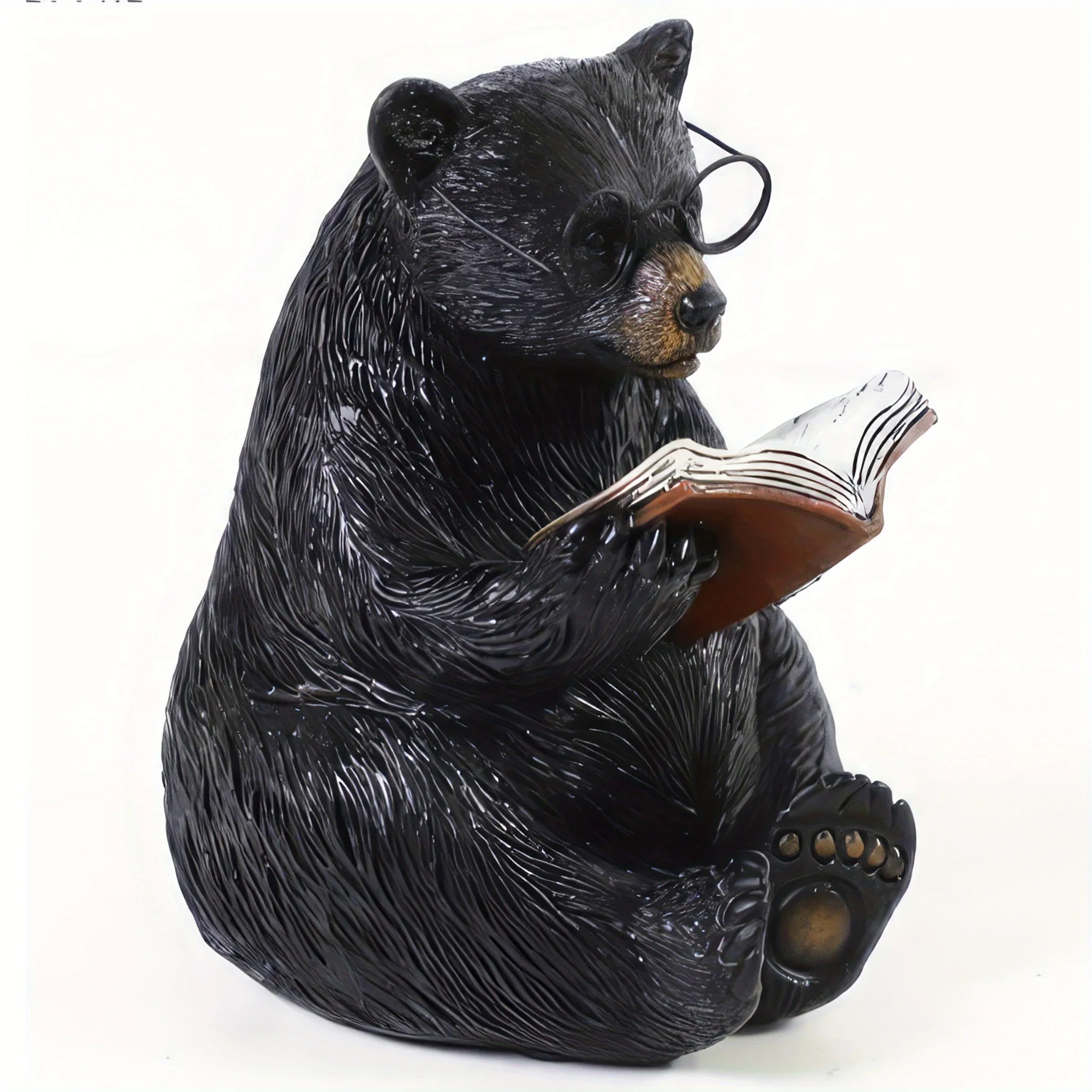 Decorative resin bear statue holding an open book with glasses