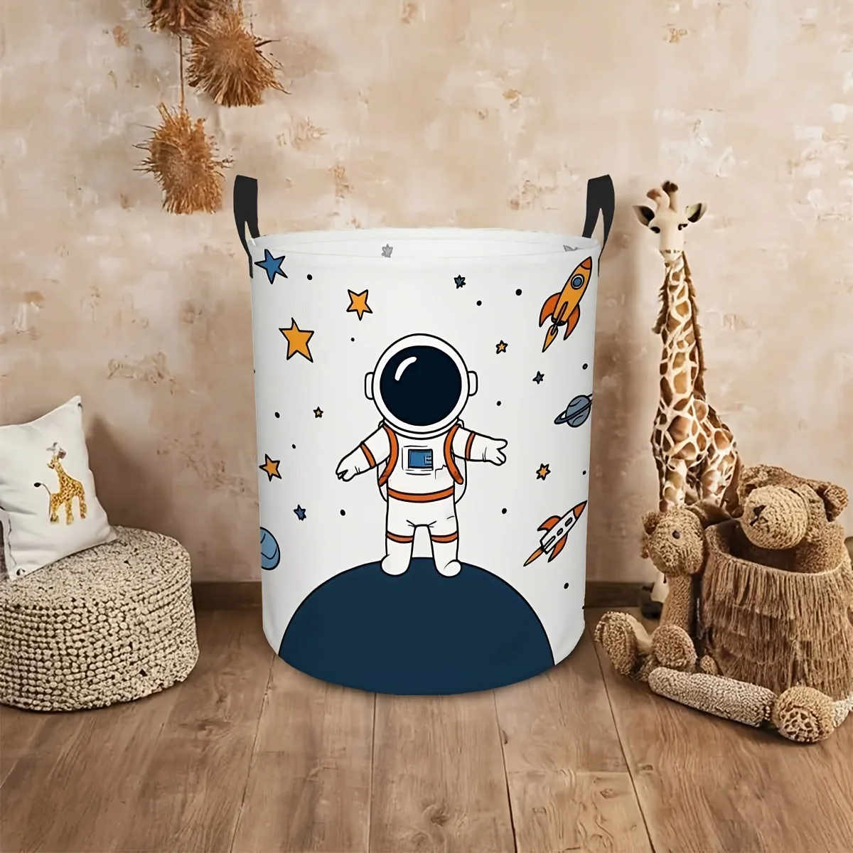 Round laundry basket with sturdy handle and space-themed design