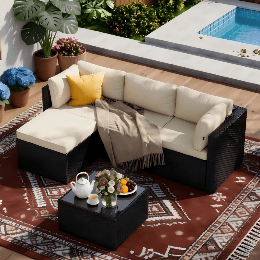 L-shaped outdoor rattan sectional with ottoman and coffee table