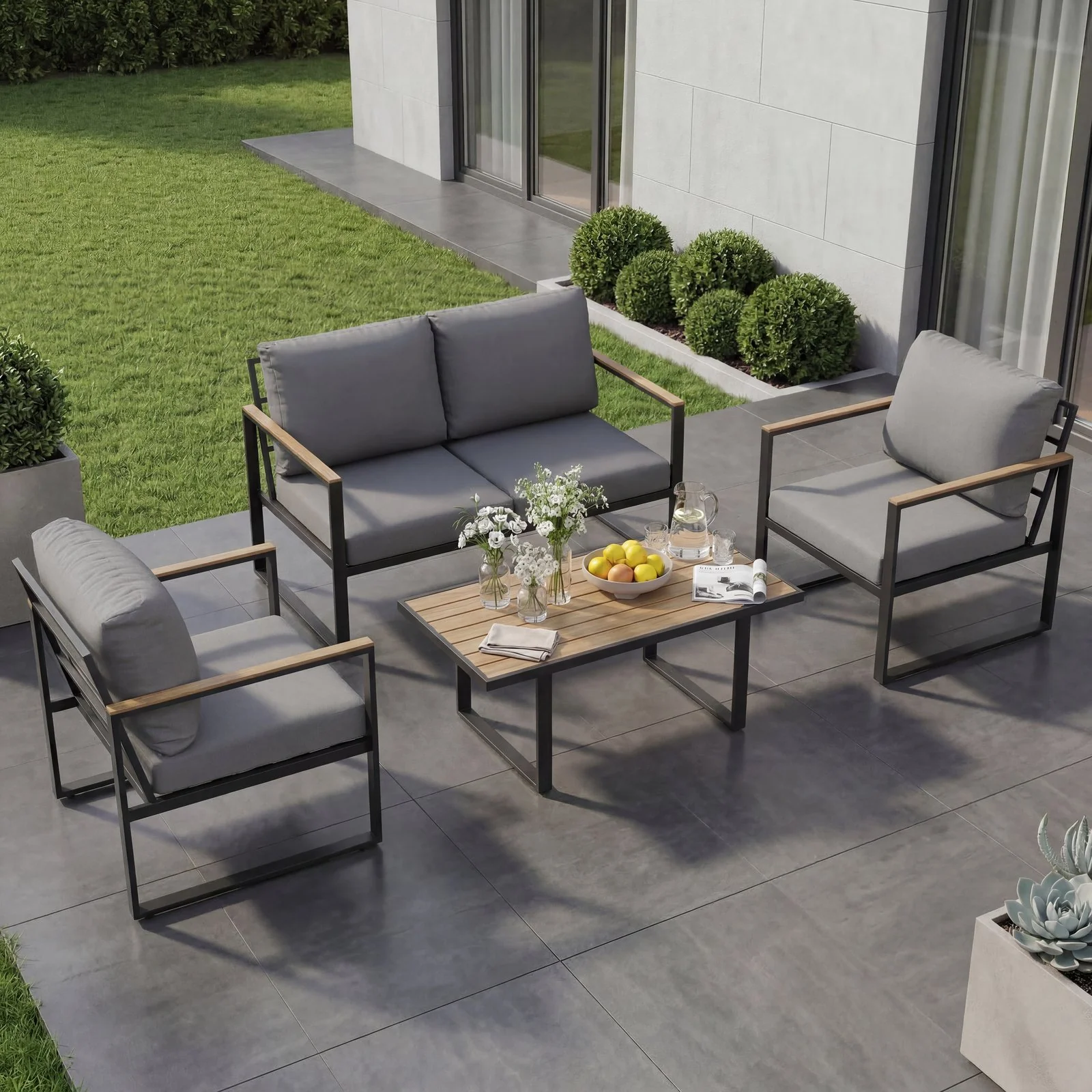Grey outdoor conversation sofa set with matching table