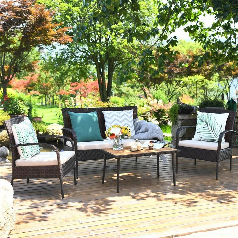 4-piece wicker patio conversation set with cushioned seats and wood table