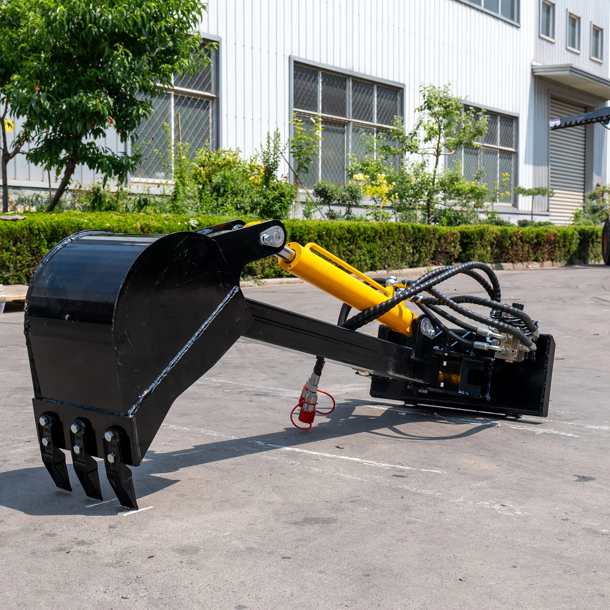 Heavy-duty swing arm backhoe attachment for skid steer loaders