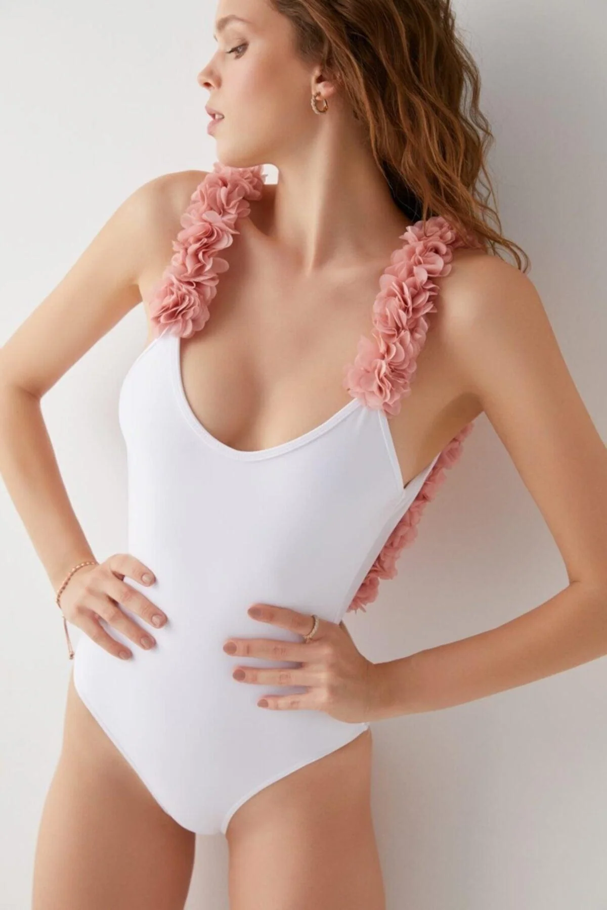 White floral swimsuit with adjustable straps