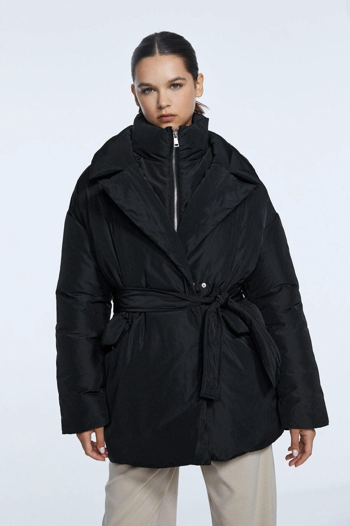 Black Arched Inflatable Coat with Stand-Up Collar and Belt Detail