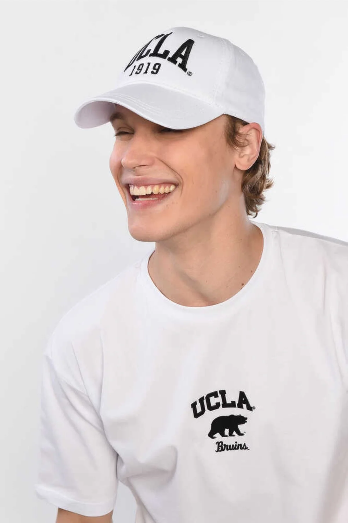 Black and white embroidered cotton baseball cap with adjustable strap