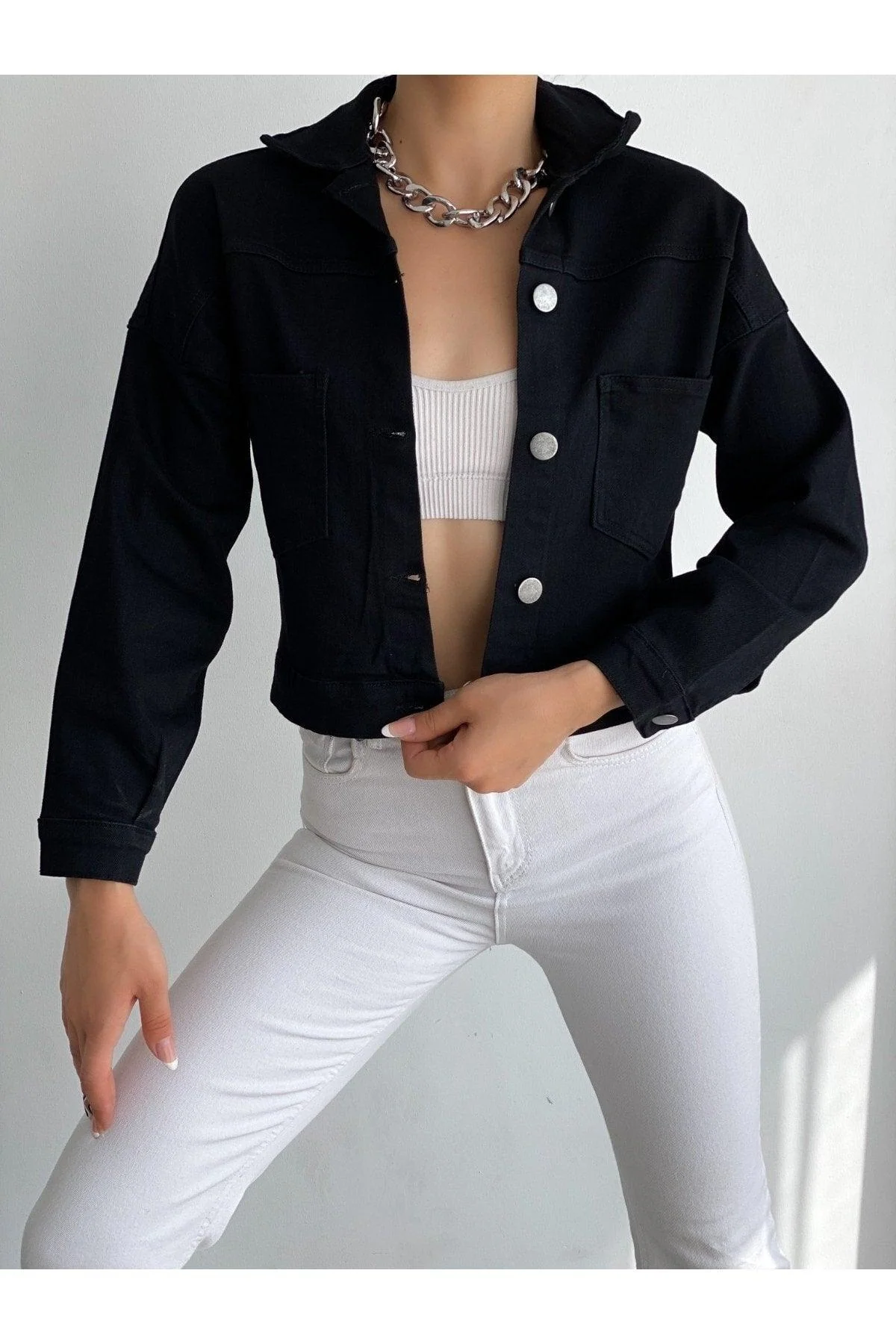 Black cropped denim jacket with sleek design