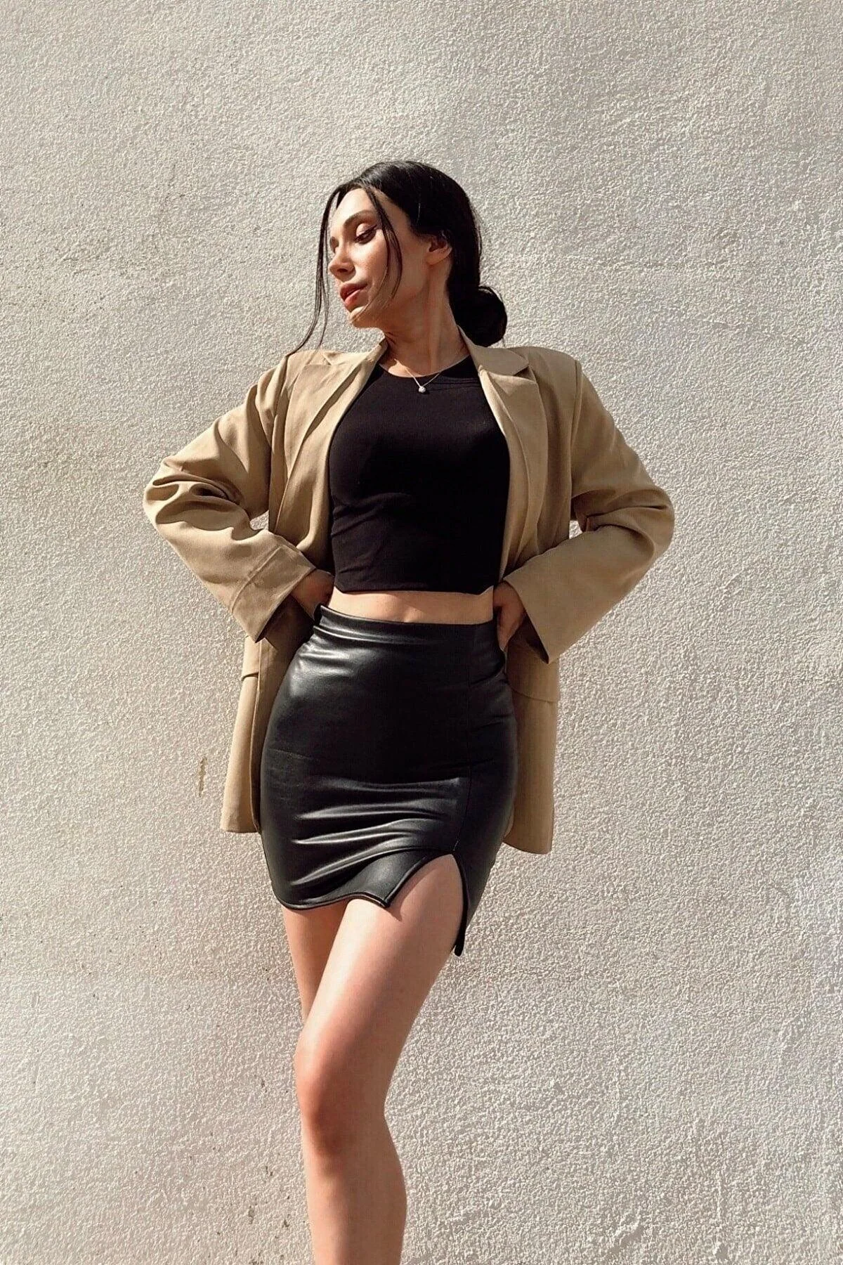 Black faux leather mini slit skirt with high waist