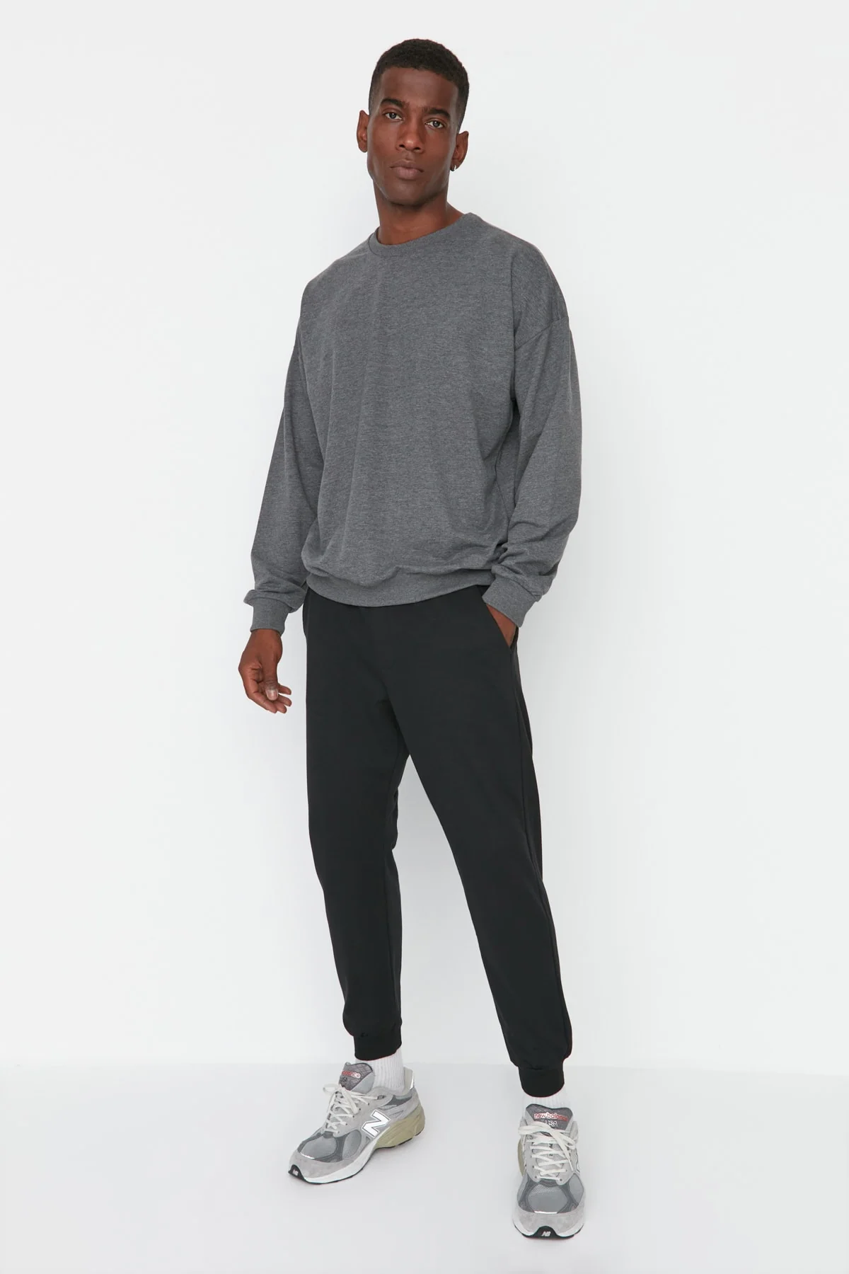 Regular fit black sweatpants with elastic cuffs for men