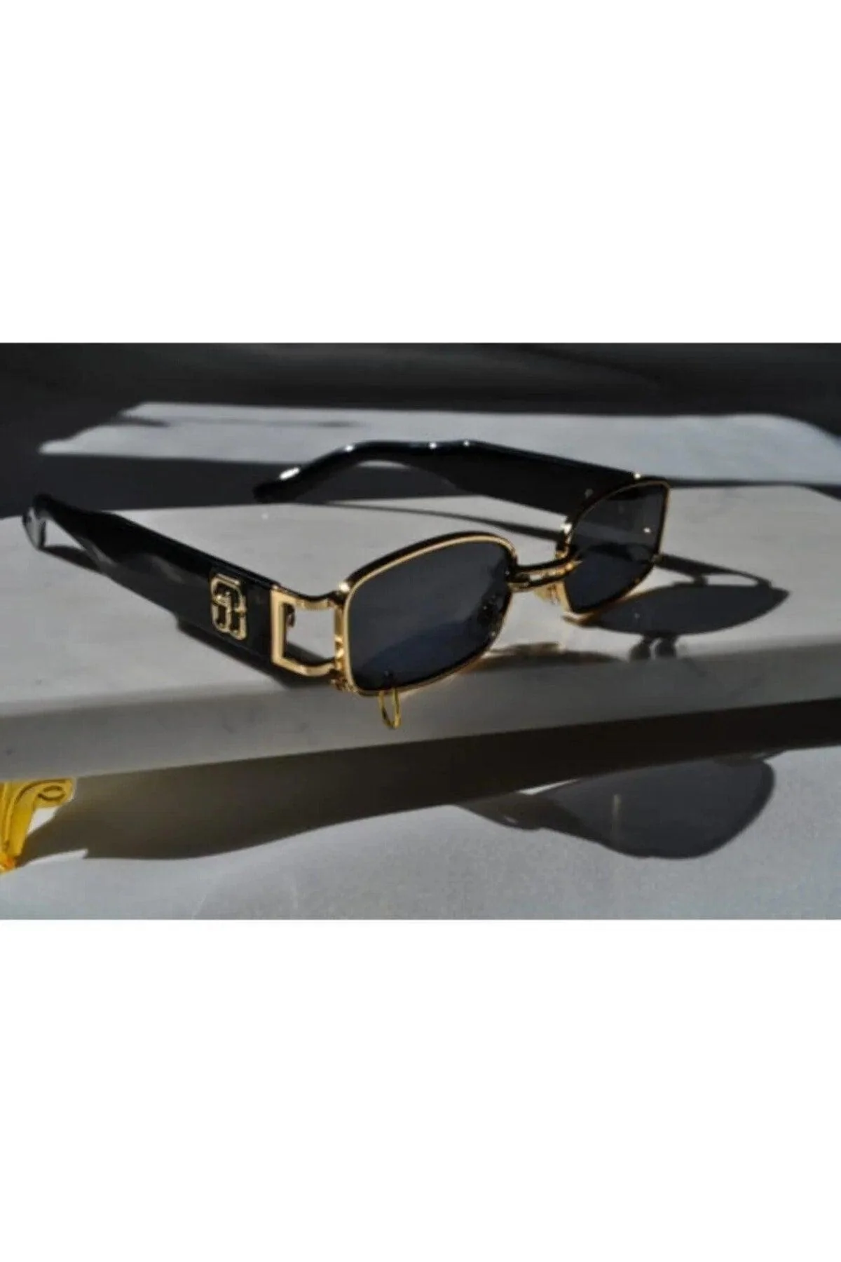 Black cat eye sunglasses with gold frame and UV400 protection
