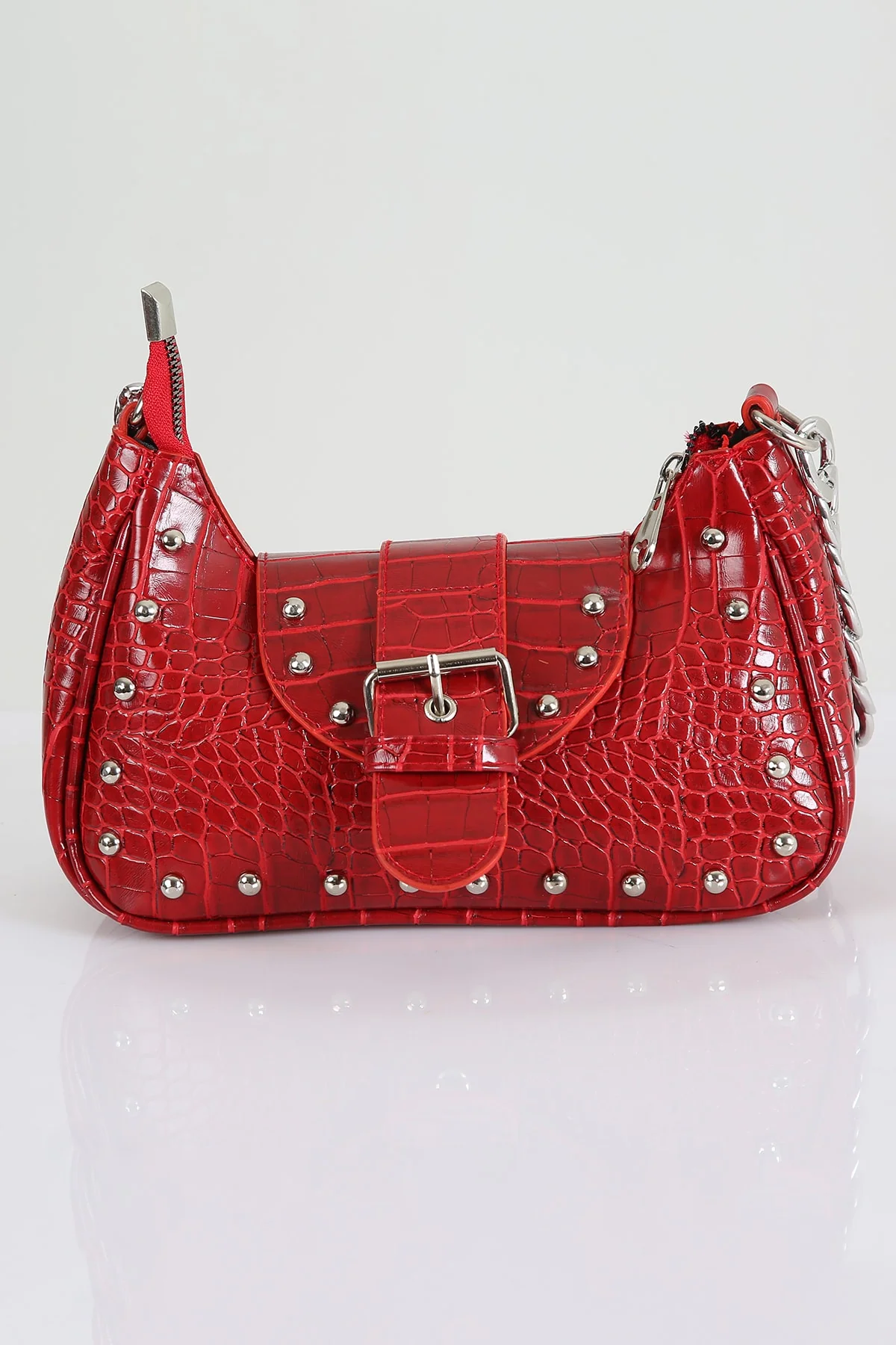 Red crocodile-patterned handle bag with metallic staples and dust bag