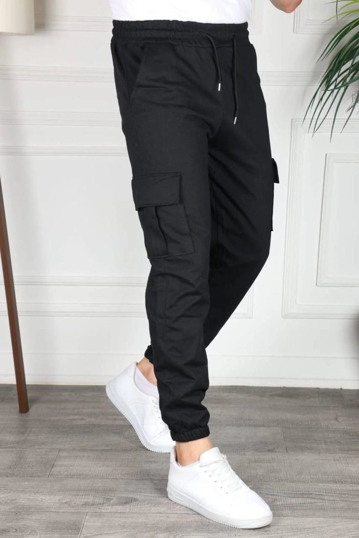Black cotton sweatpants with cargo pockets and elastic cuffs