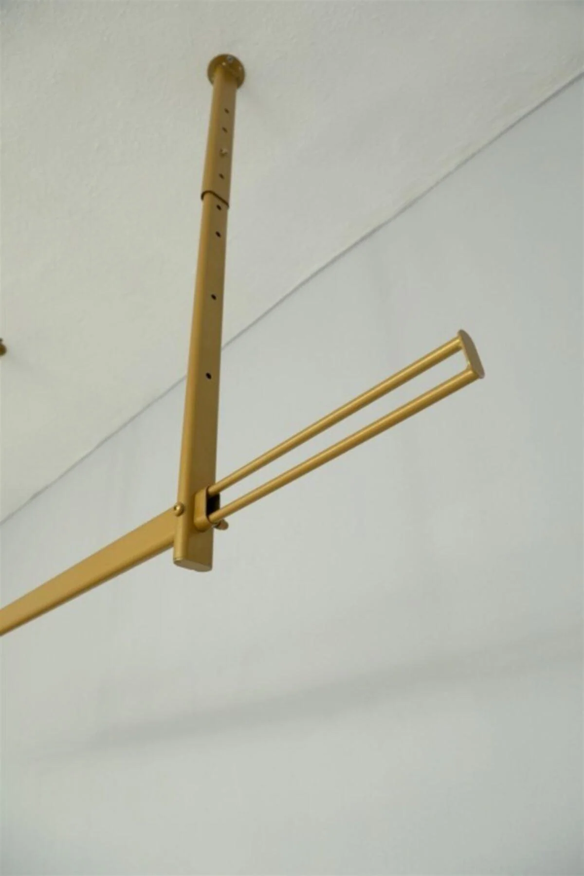 Ceiling-mounted adjustable service stand with gold finish