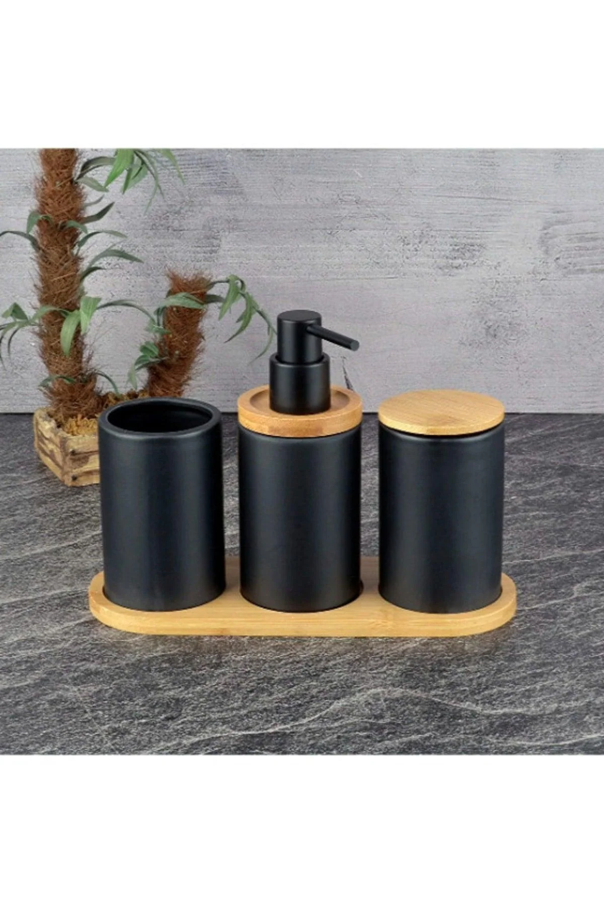 Black ceramic bathroom set with bamboo stand and soap dispenser
