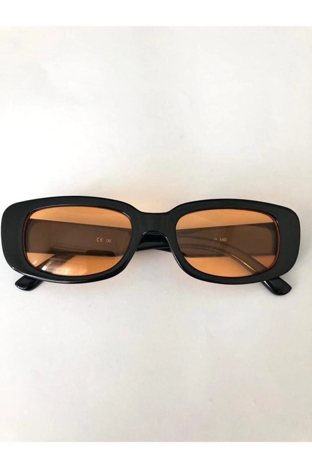 Chunky black and orange sunglasses with UV 400 protection