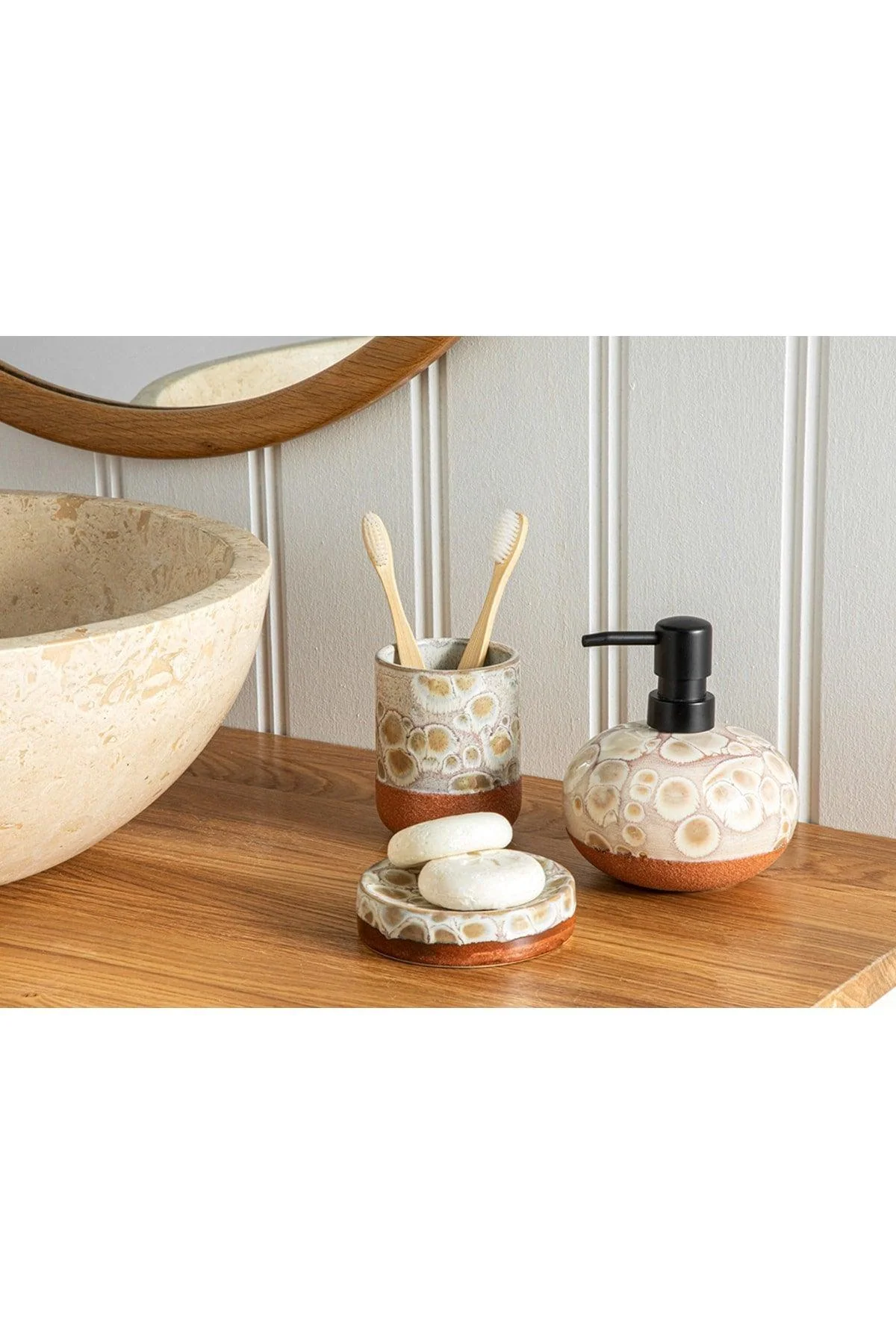Coastal-themed stoneware bathroom accessories set in cream