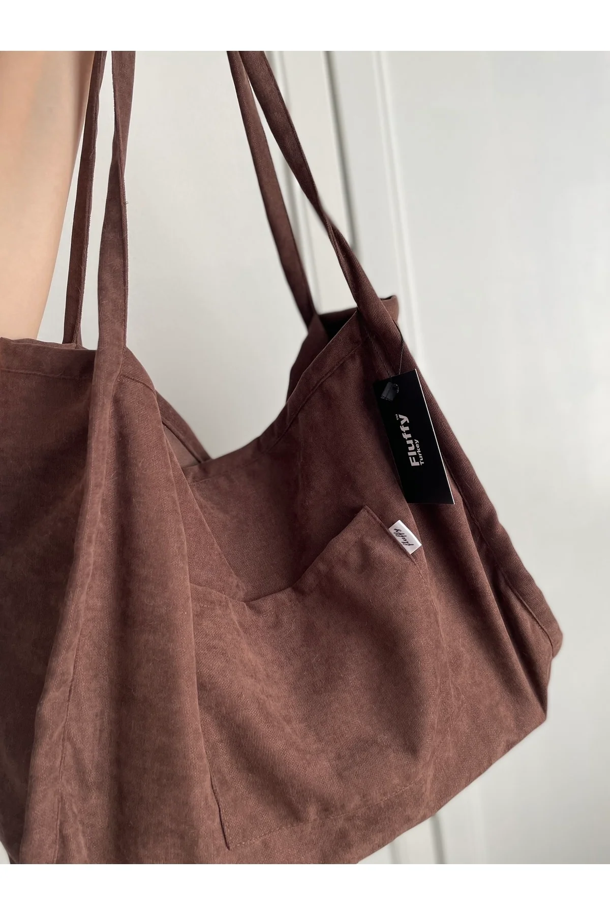 Light brown tote bag with zipper and pockets