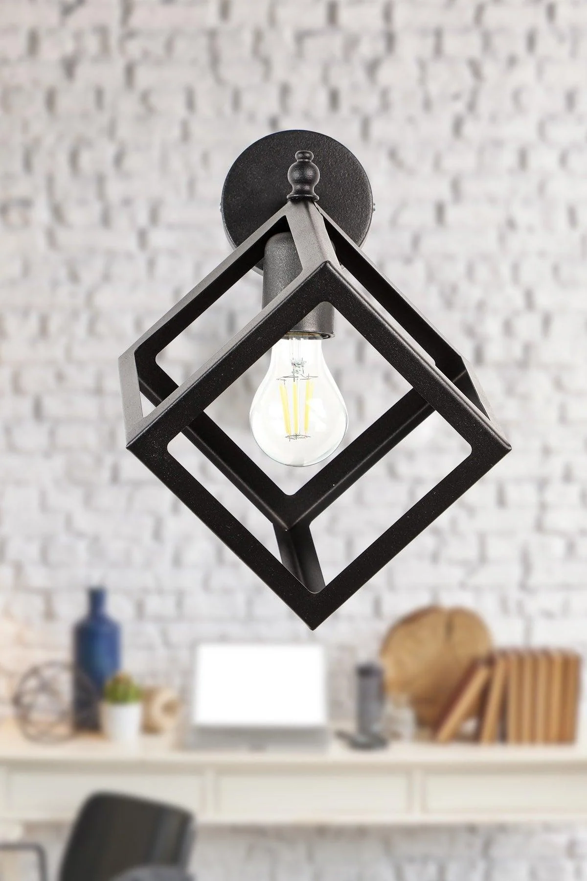 Cube-shaped wall sconce in black finish for versatile lighting