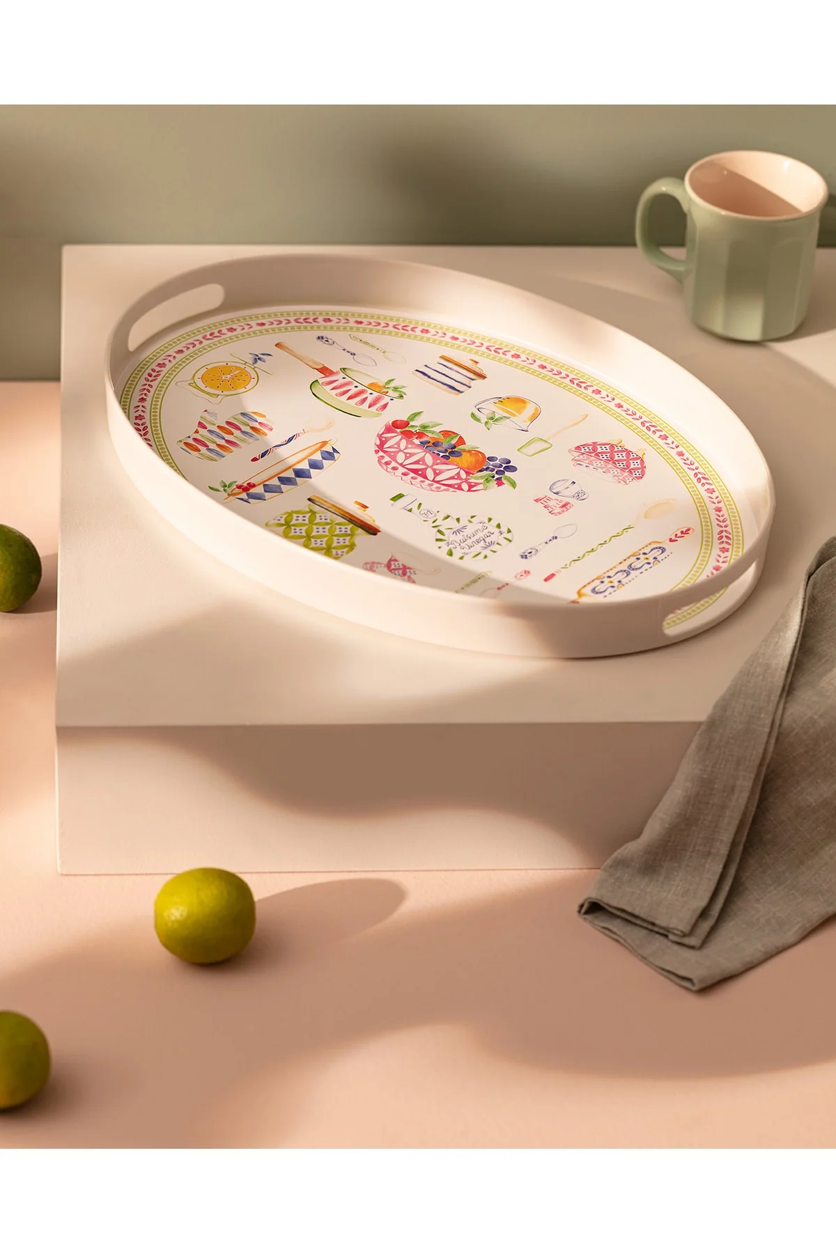 Oval plastic serving tray in green and pink