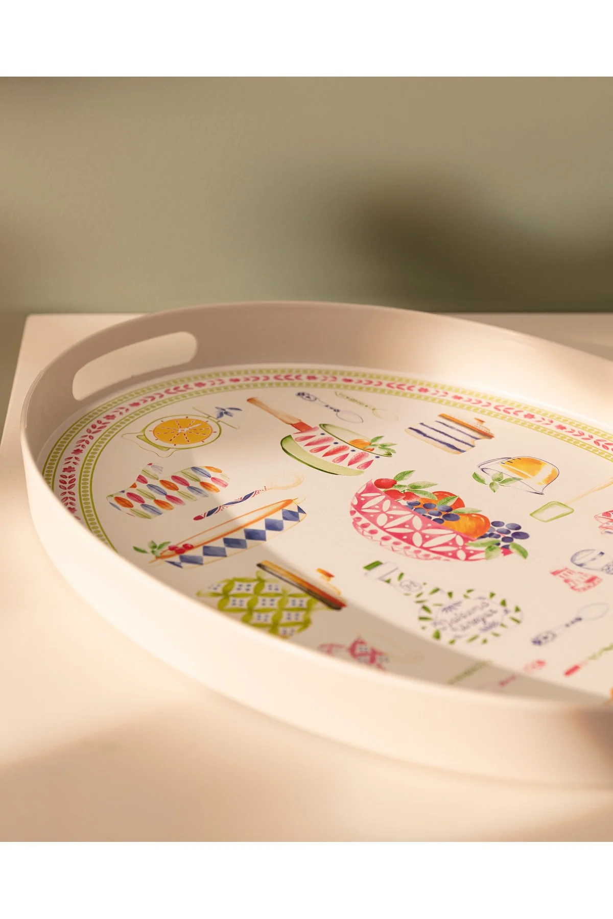 Oval plastic serving tray in green and pink