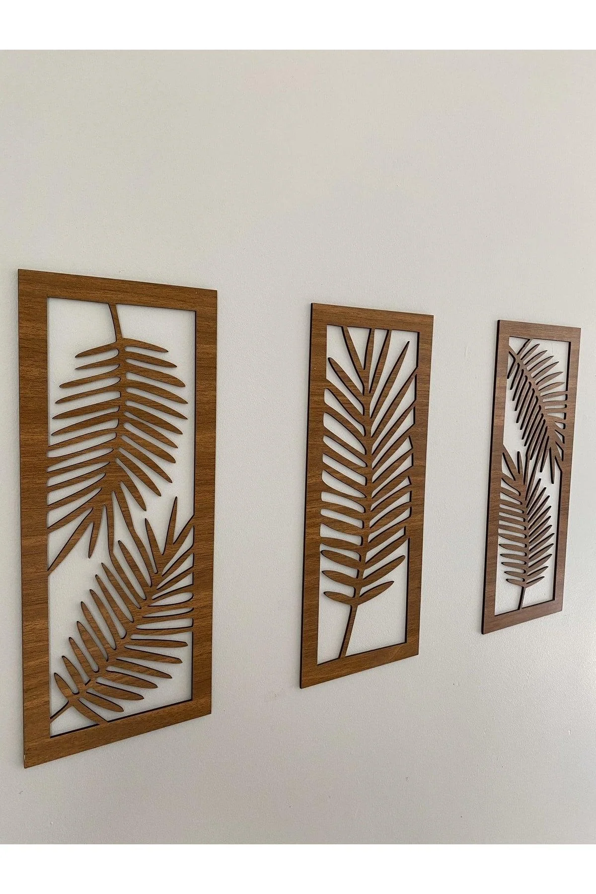 Triple leaf wooden wall decor in walnut finish