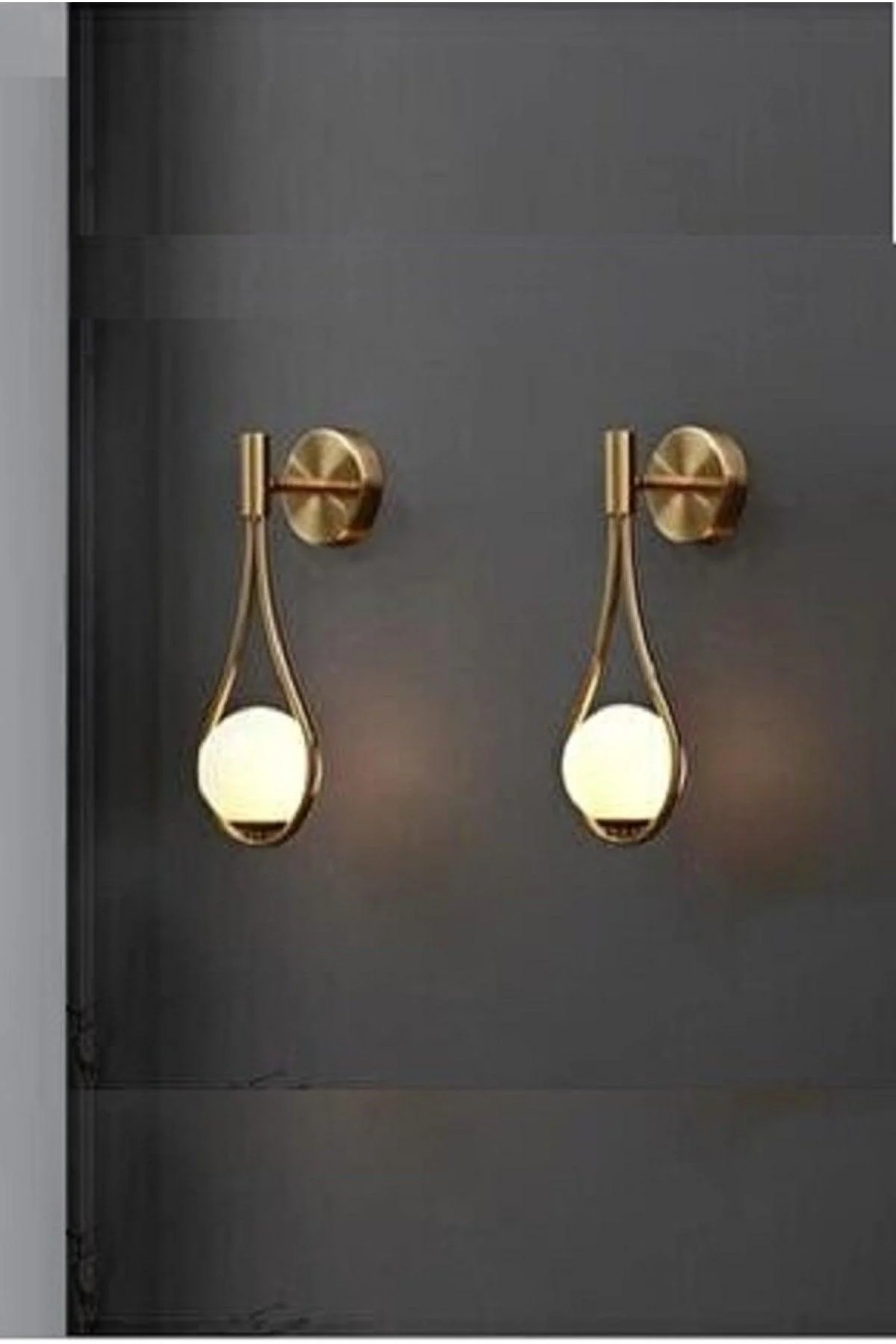 Gold electroplated drop sconce with opal glass shade