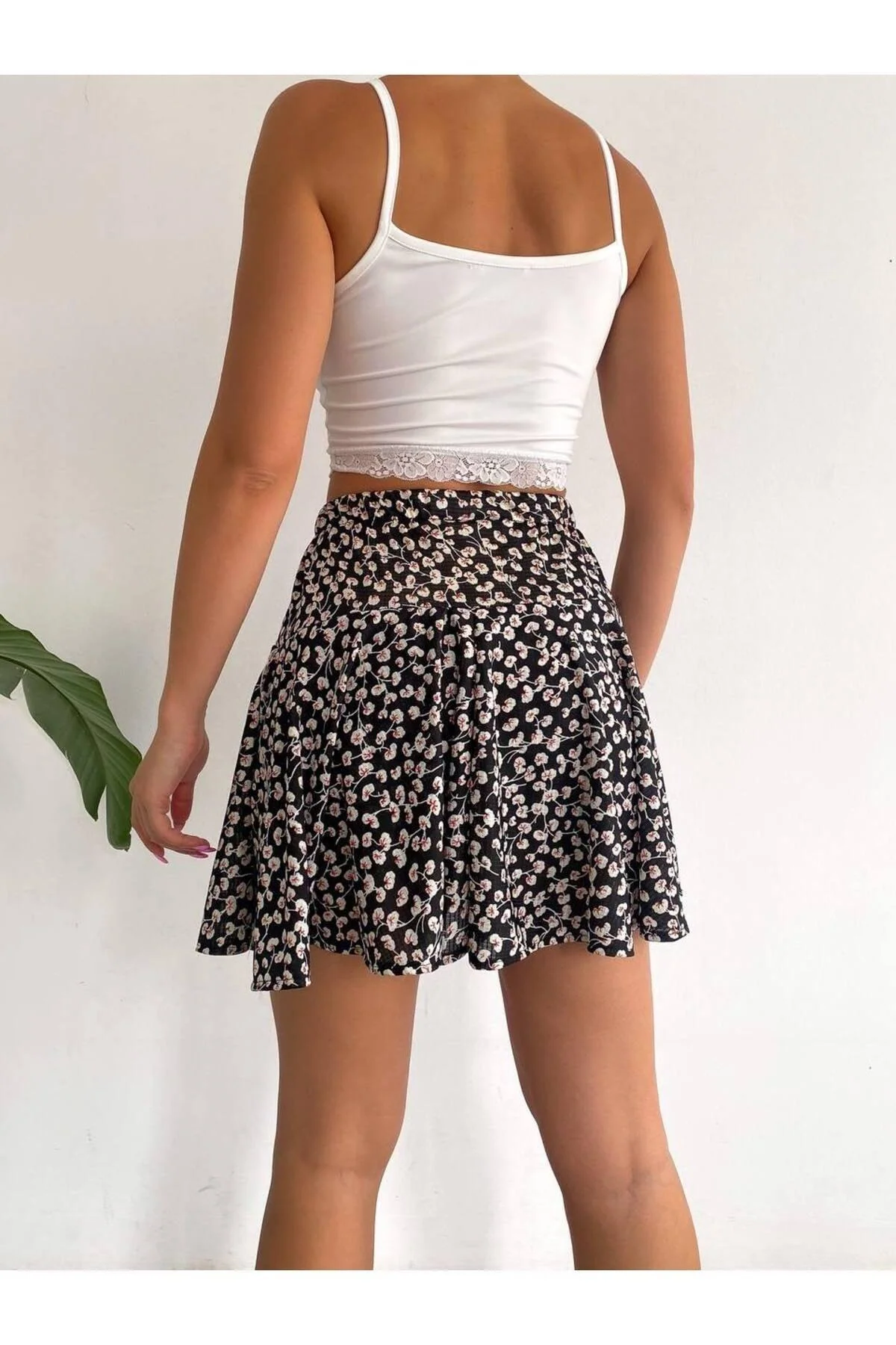 Black floral patterned short skirt with stretchy waistband