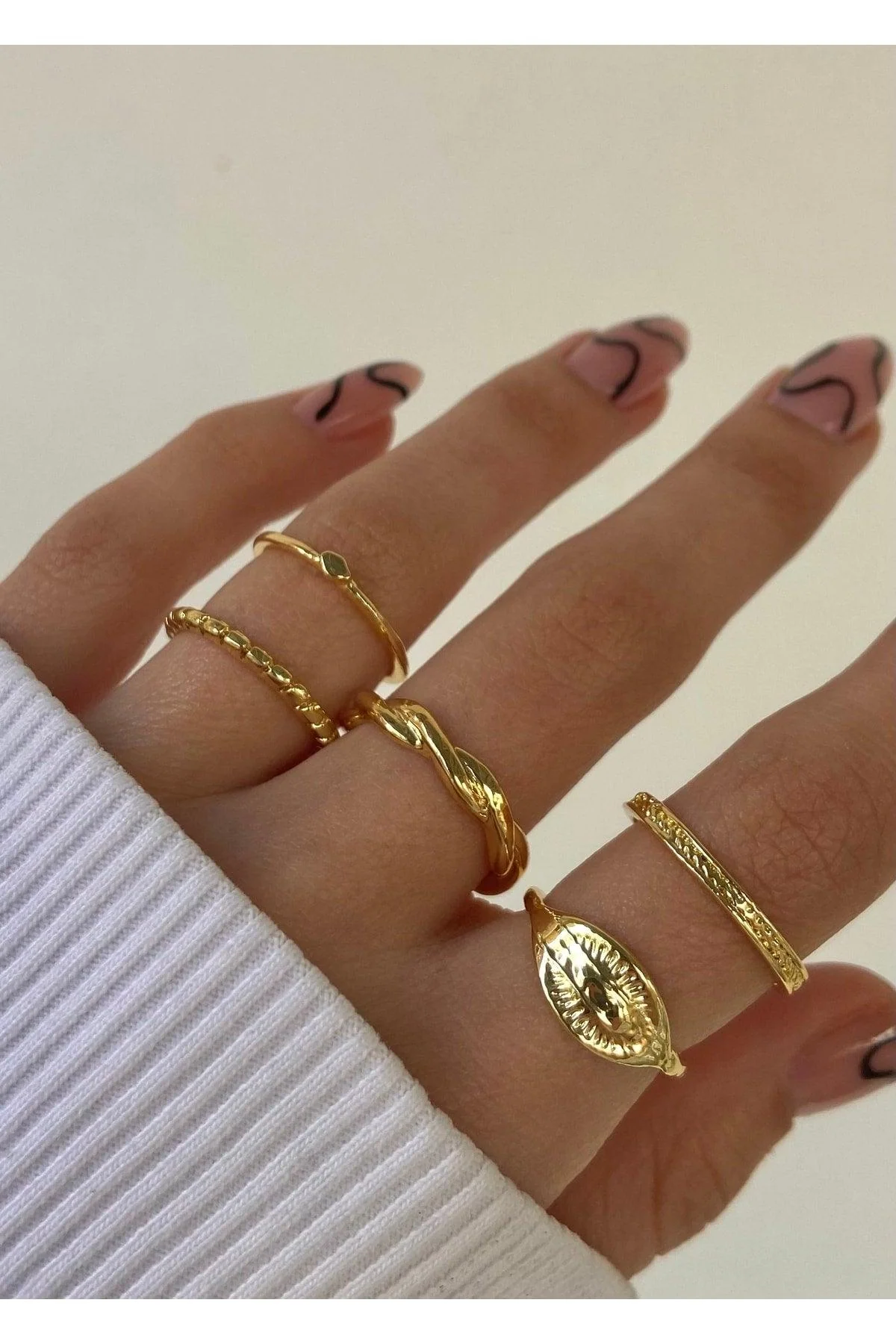 Set of 5 gold-colored adjustable rings