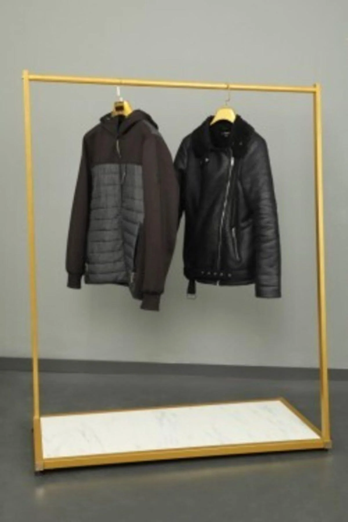 Gold cross-legged standing shelf unit with chipboard shelf