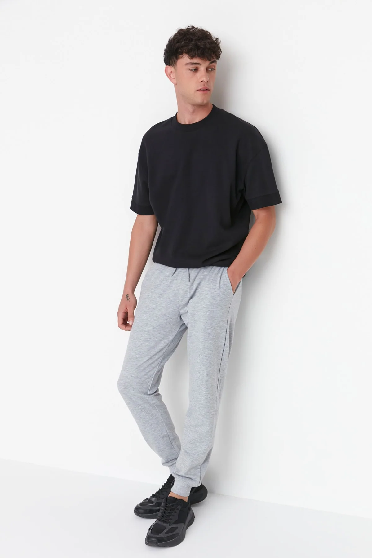 Regular fit grey sweatpants with elastic cuffs for men