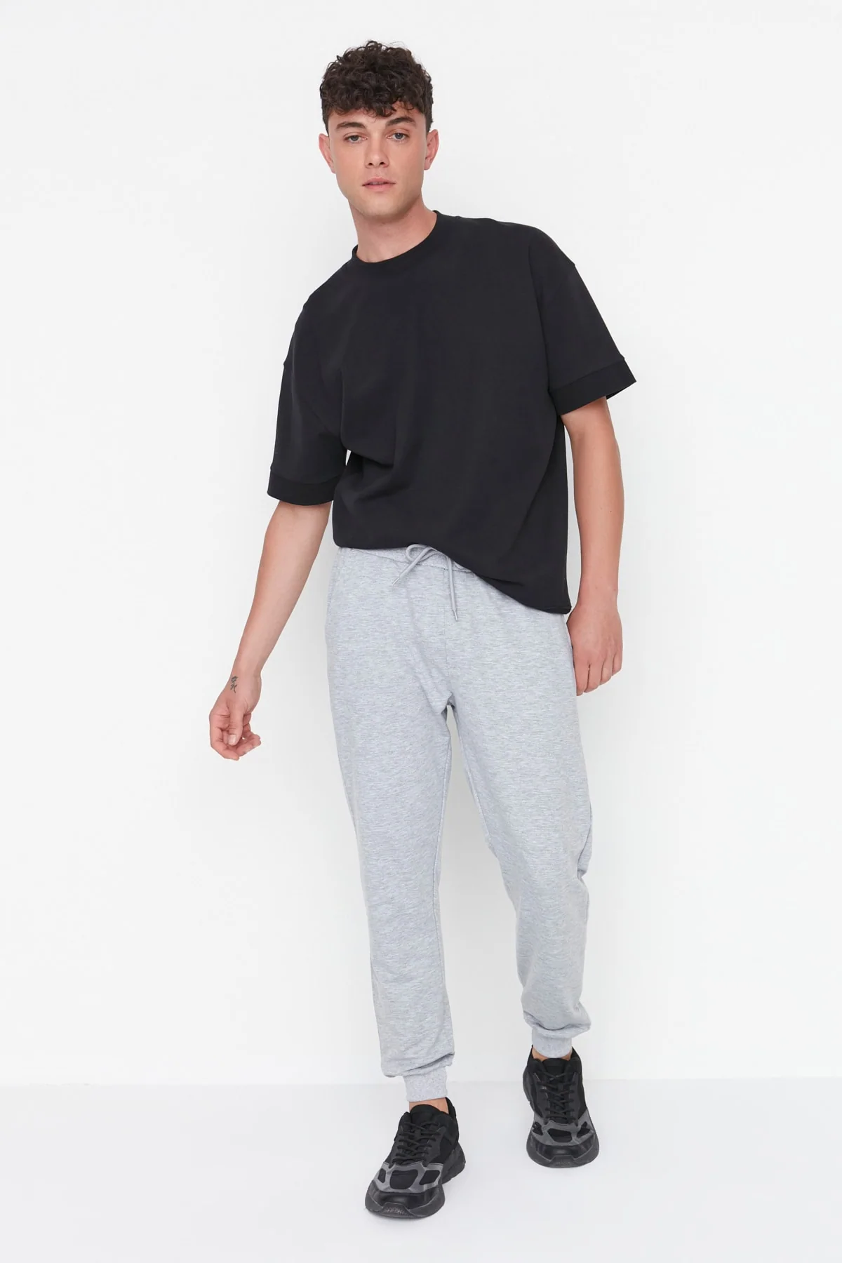 Regular fit grey sweatpants with elastic cuffs for men