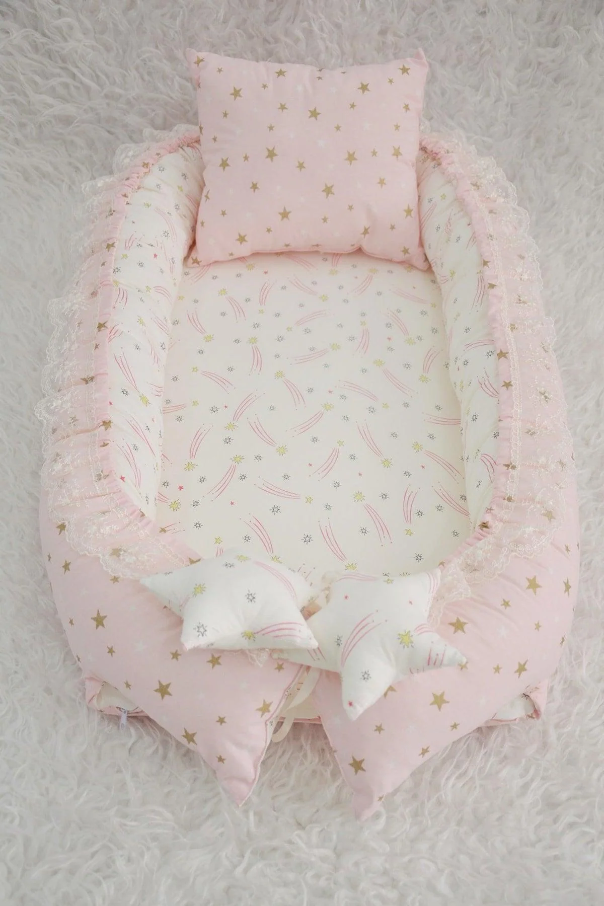Pink portable baby nest and travel sleep pod with removable pillow
