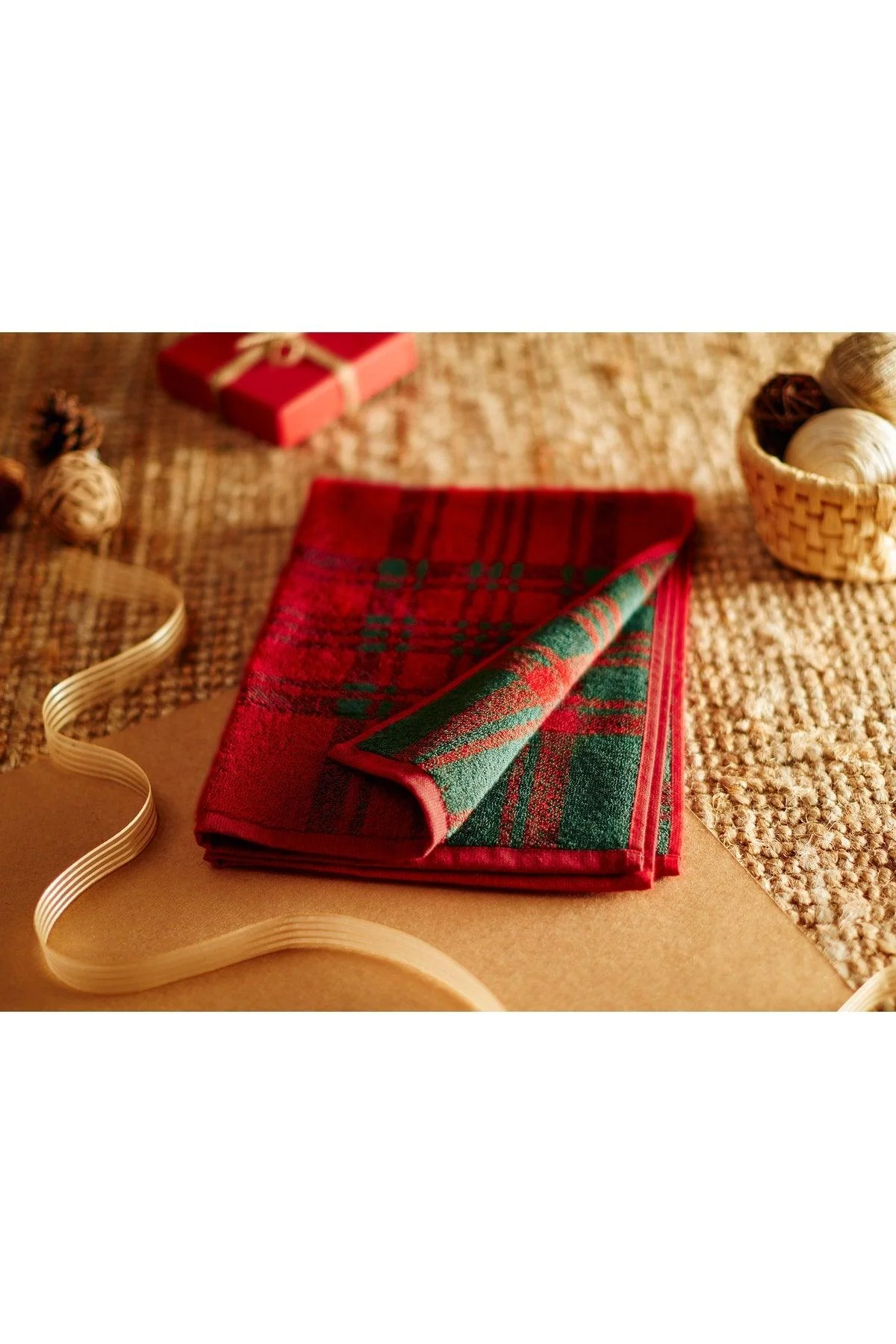 Christmas-themed red cotton face towel with green stripes