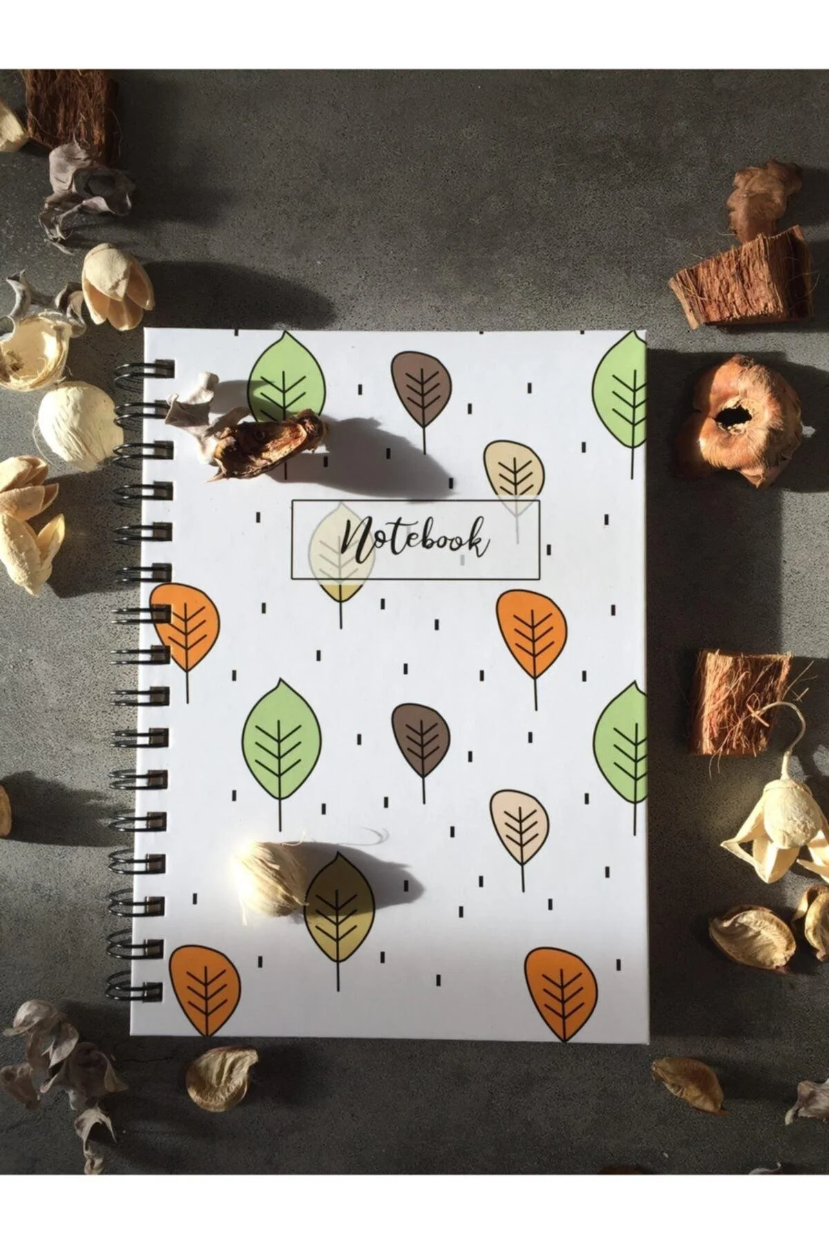 100-page unlined spiral notebook with leaf pattern cover