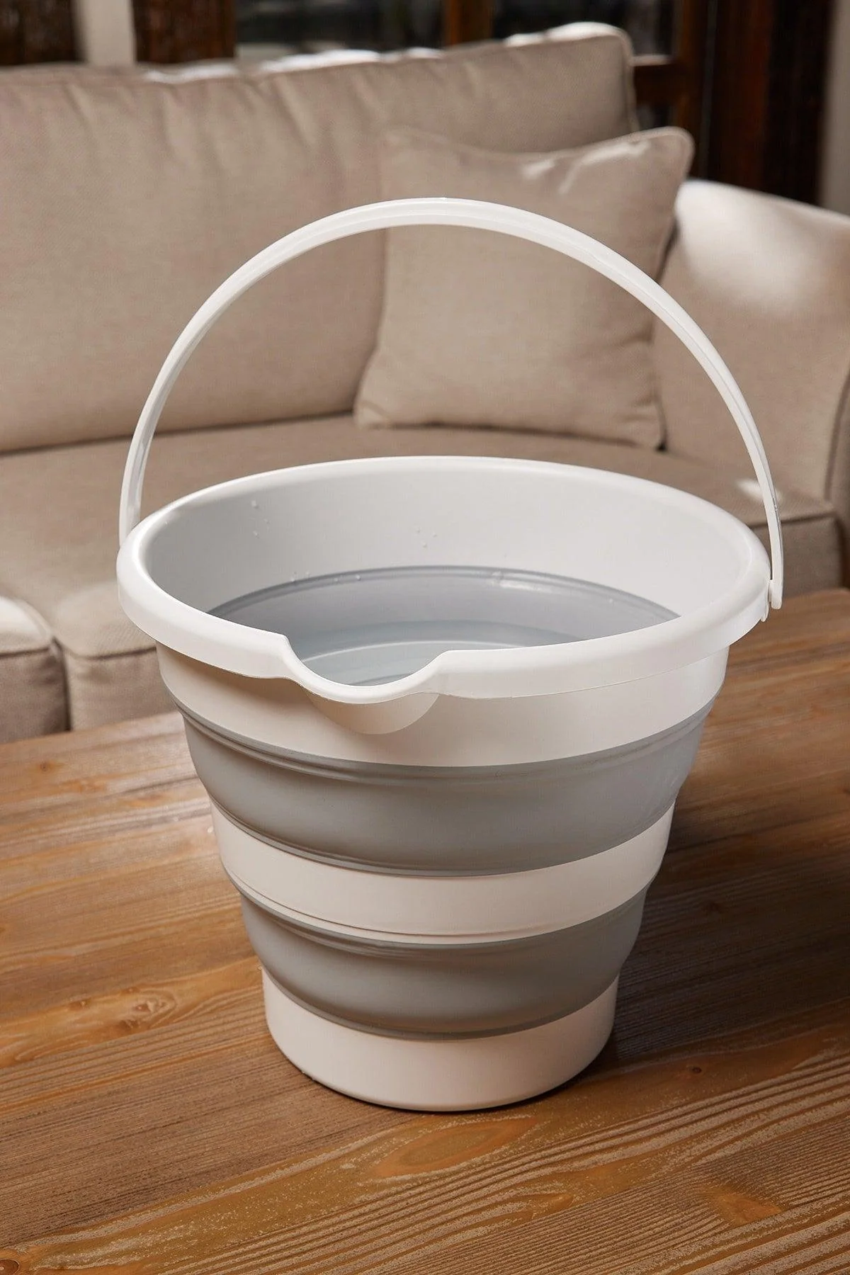 Collapsible 12-liter gray accordion-style water bucket