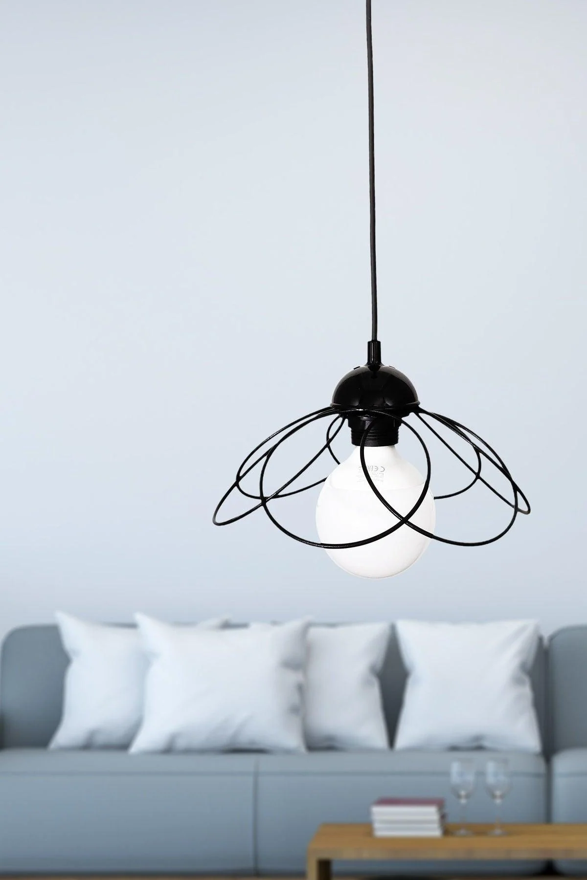 Black metal wall sconce with E27 bulb socket