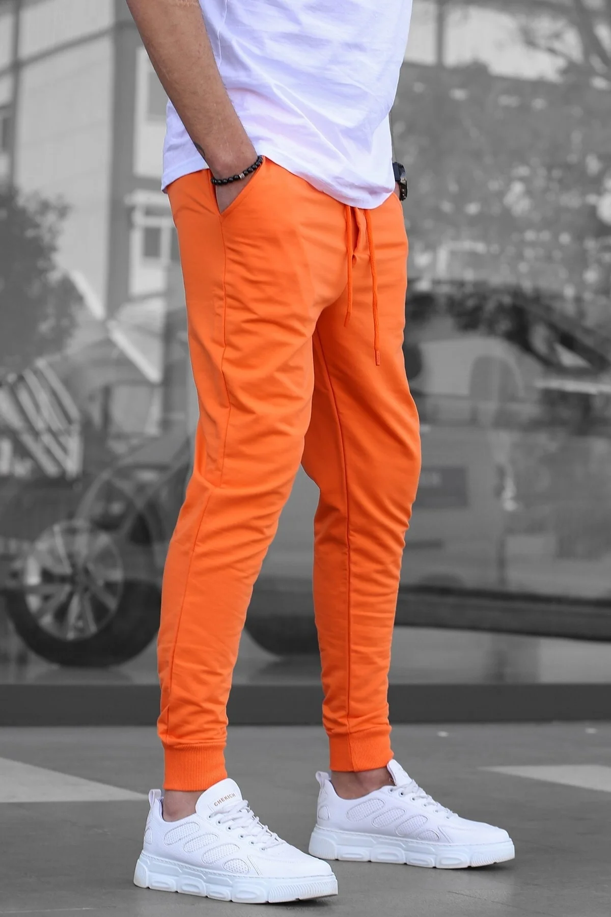 Men's relaxed-fit cotton blend tracksuit in orange with elasticated cuffs