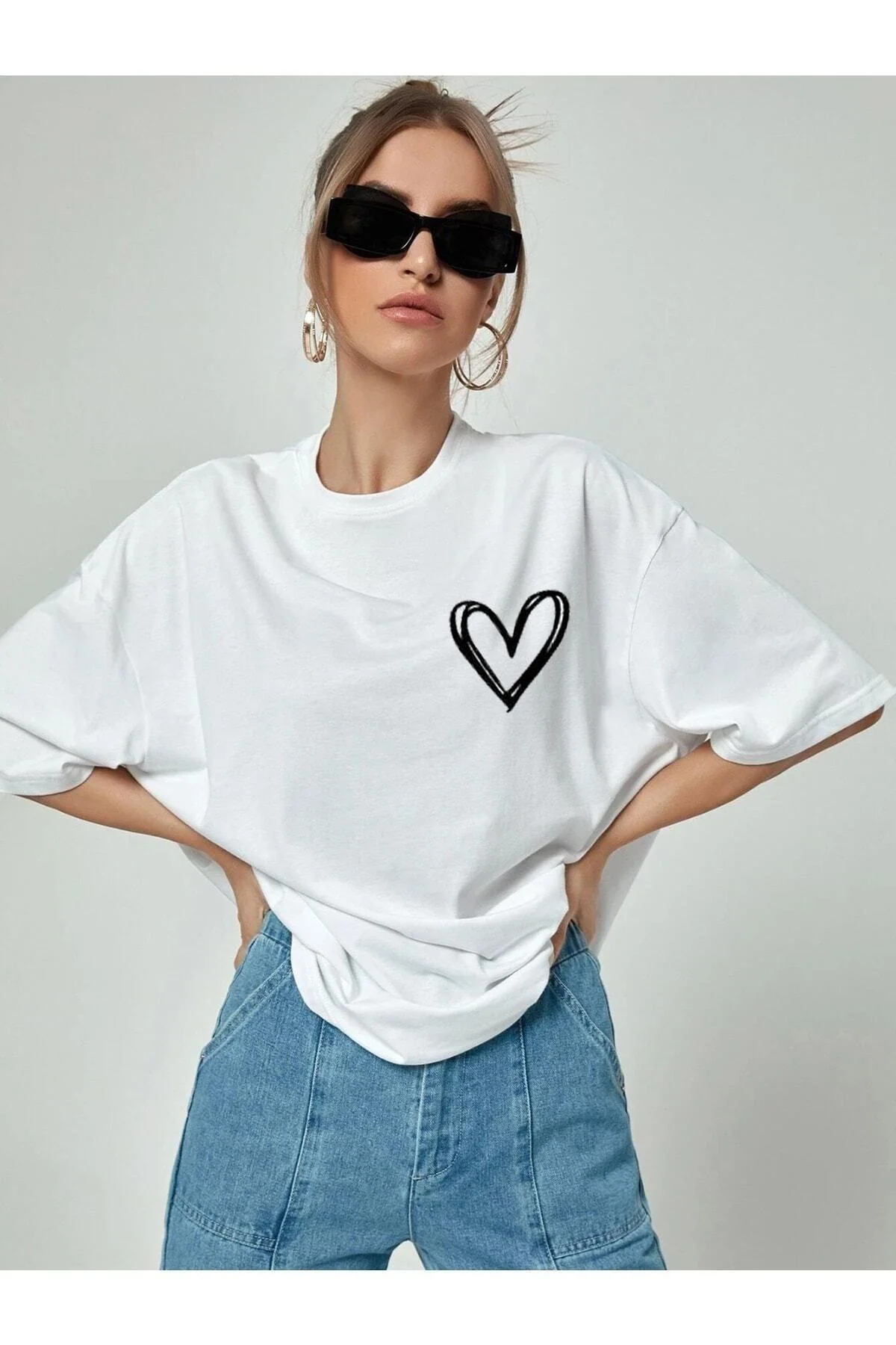 White oversize t-shirt with minimal heart print