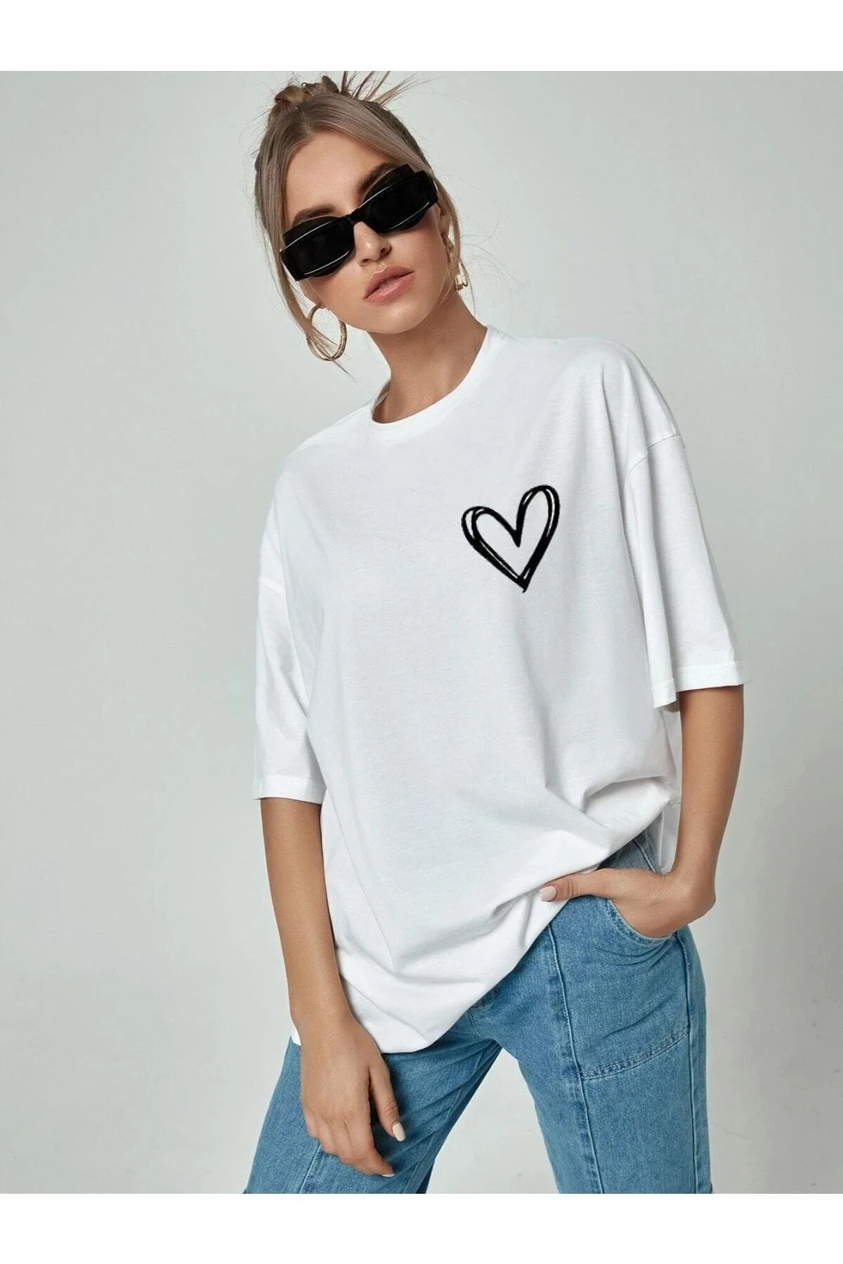 White oversize t-shirt with minimal heart print