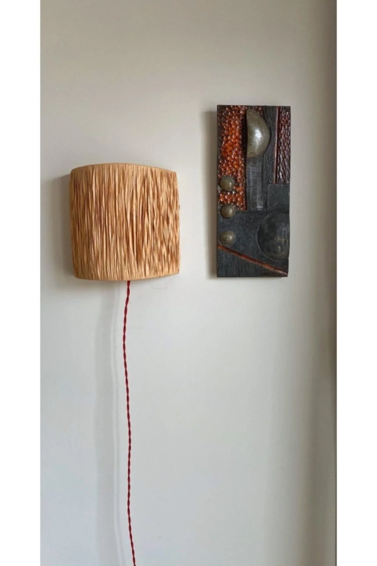 Handmade natural fiber wall applique with soft ambient lighting