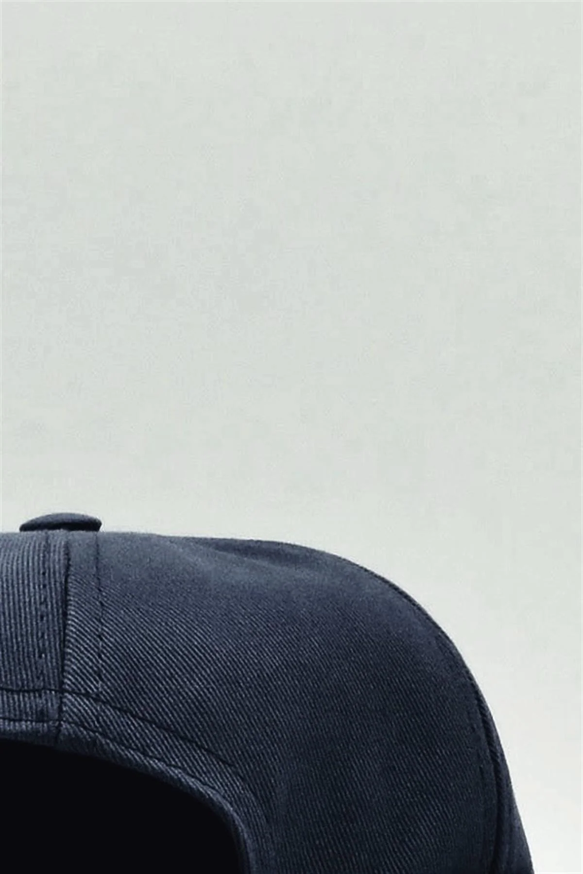 Navy blue cotton cap with adjustable fit