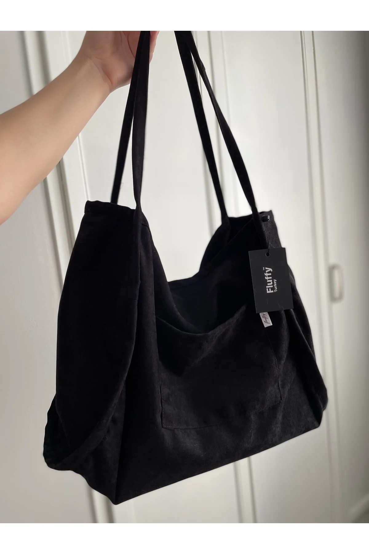 Classic black tote bag with zipper and pockets